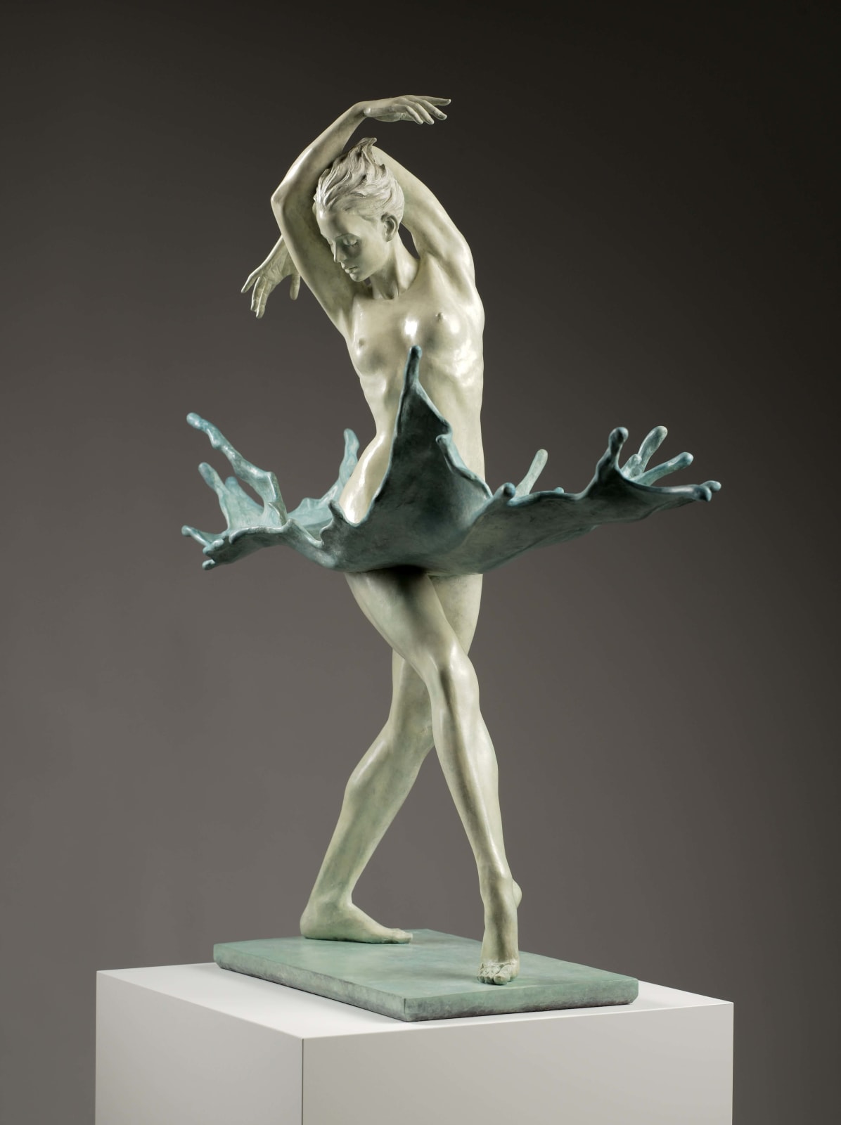 Walking through water contemporary bronze sculpture Liang Binbin Chinese artist green sea water sculpture a beautiful girl swimming or dancing in a big wave sculpture art at Art Yi gallery in Brussels