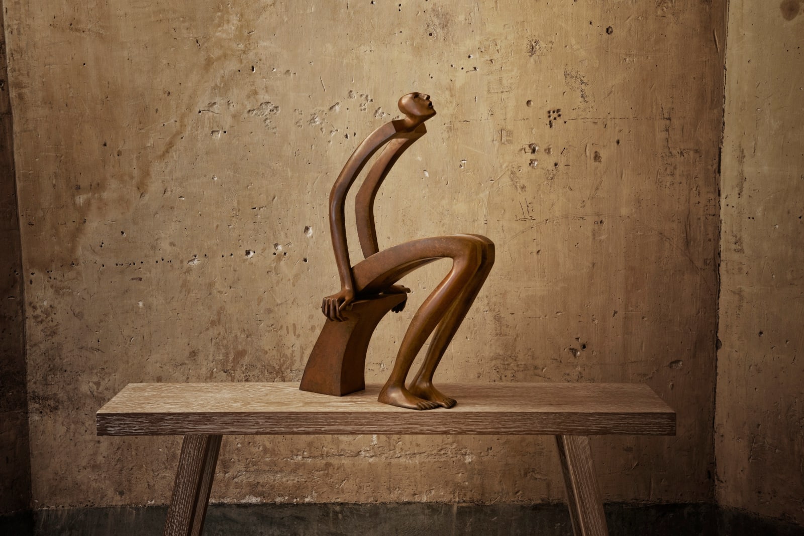 Isabel miramontes contemporary bronze sculpture abstract art sculpture decoration design minimalism interrogation a sitting man sculpture watching the star