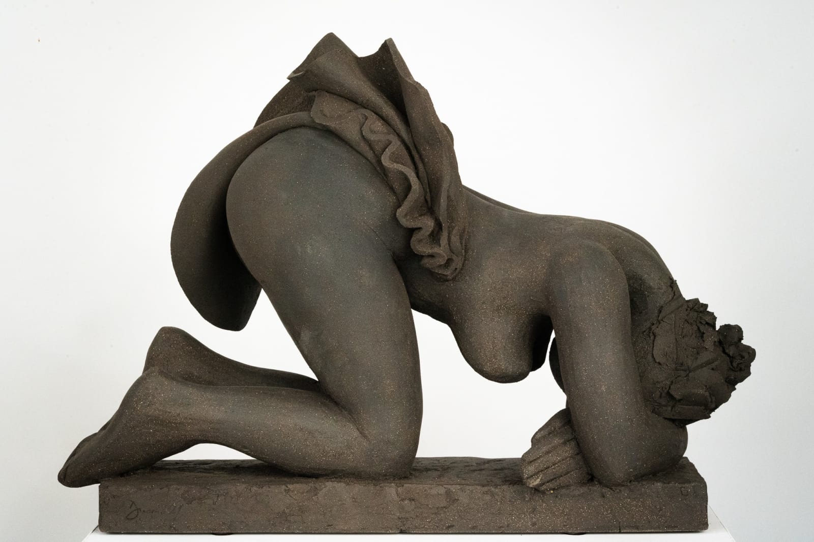 Figurative ceramics sculpture by artist Emilio DiIorio. Female figure is No. 5 in artist's Seated Bathers series in black clay.