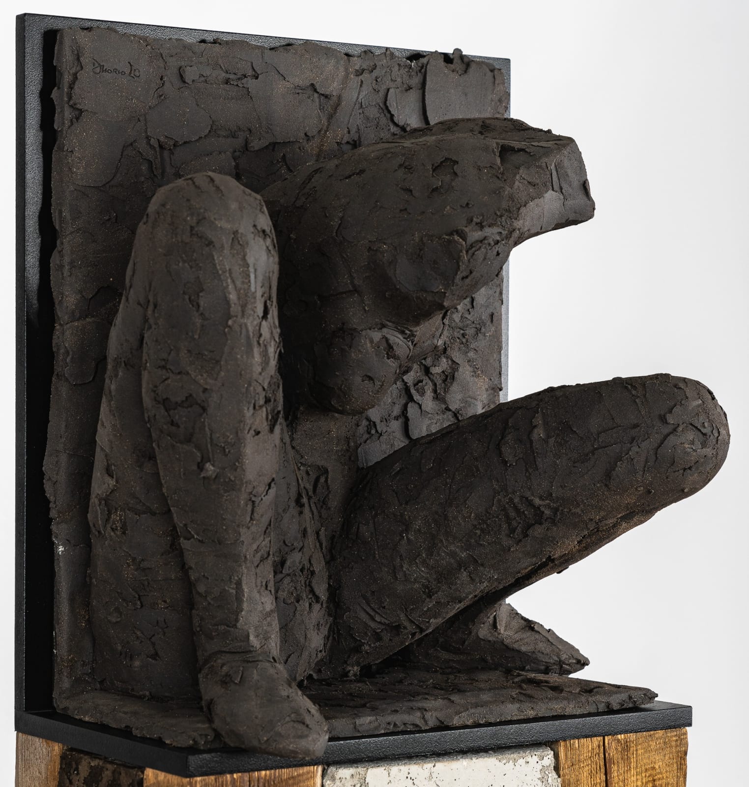Ceramic relief in black clay in sculptor Emilio DiIorio's Women of Troy series.