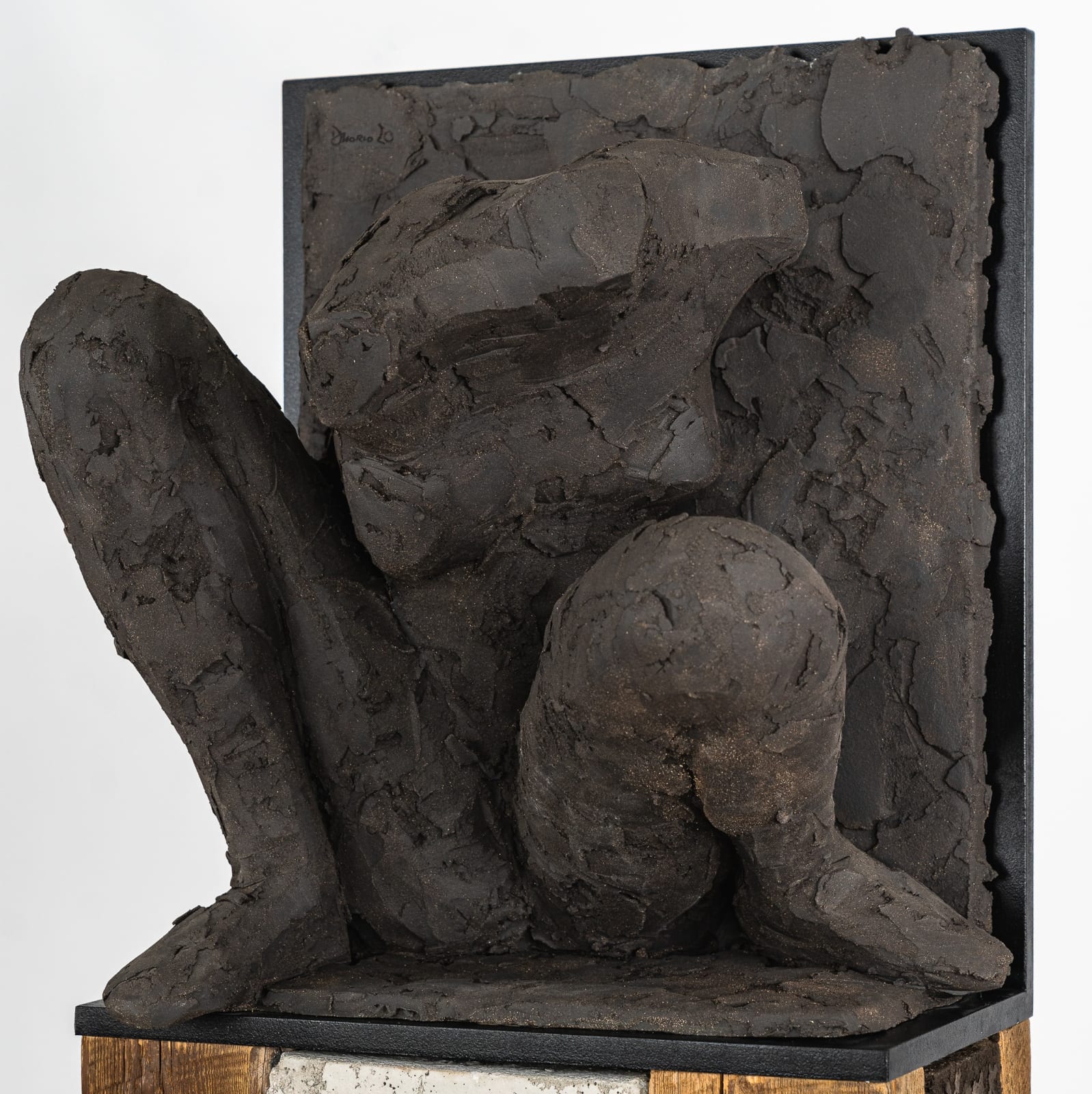 Ceramic relief in black clay in sculptor Emilio DiIorio's Women of Troy series.