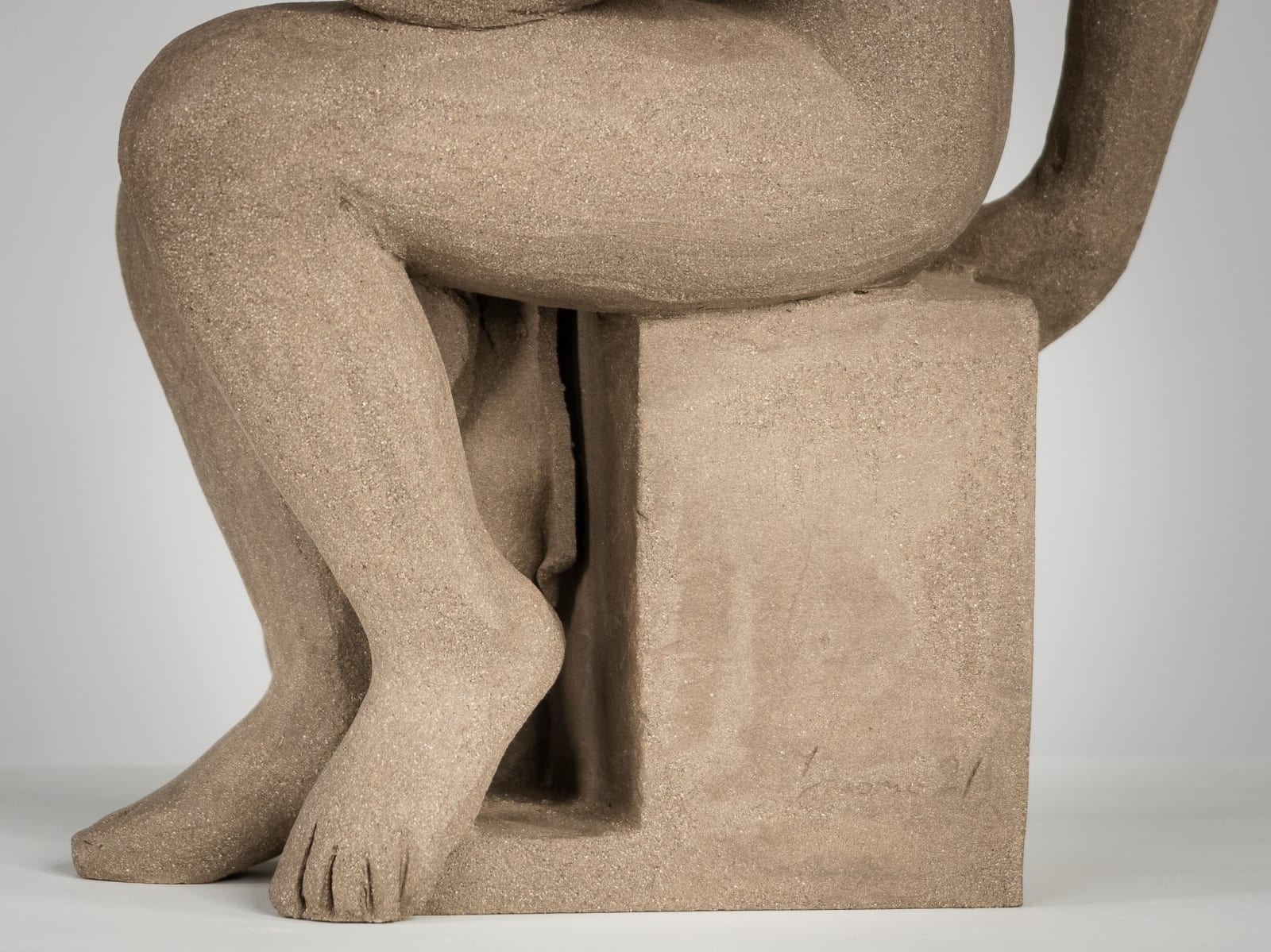 Figurative ceramics sculpture by artist Emilio DiIorio. Female figure is No. 4 in artist's Seated Bathers series in gray clay.