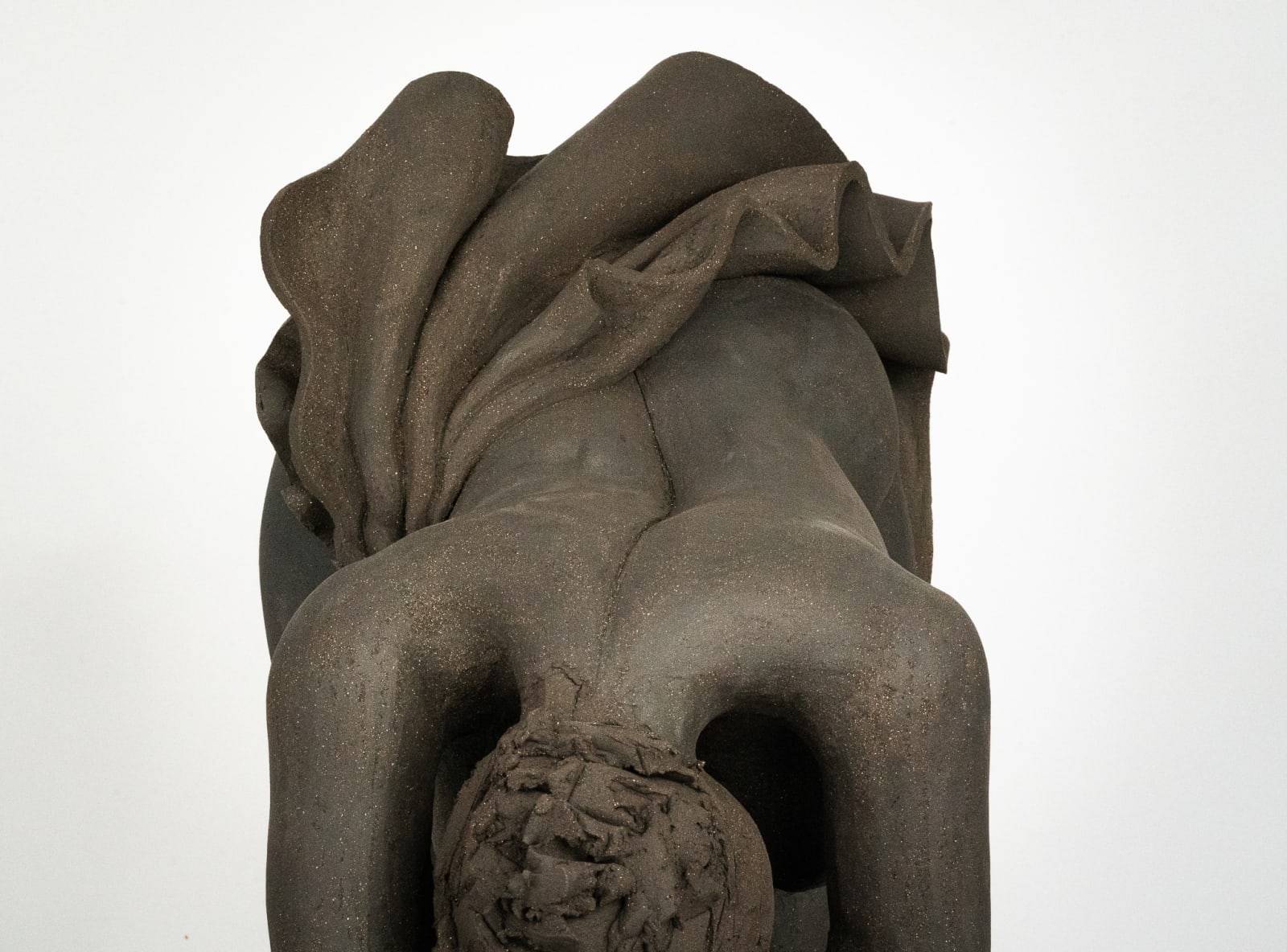 Figurative ceramics sculpture by artist Emilio DiIorio. Female figure is No. 5 in artist's Seated Bathers series in black clay.