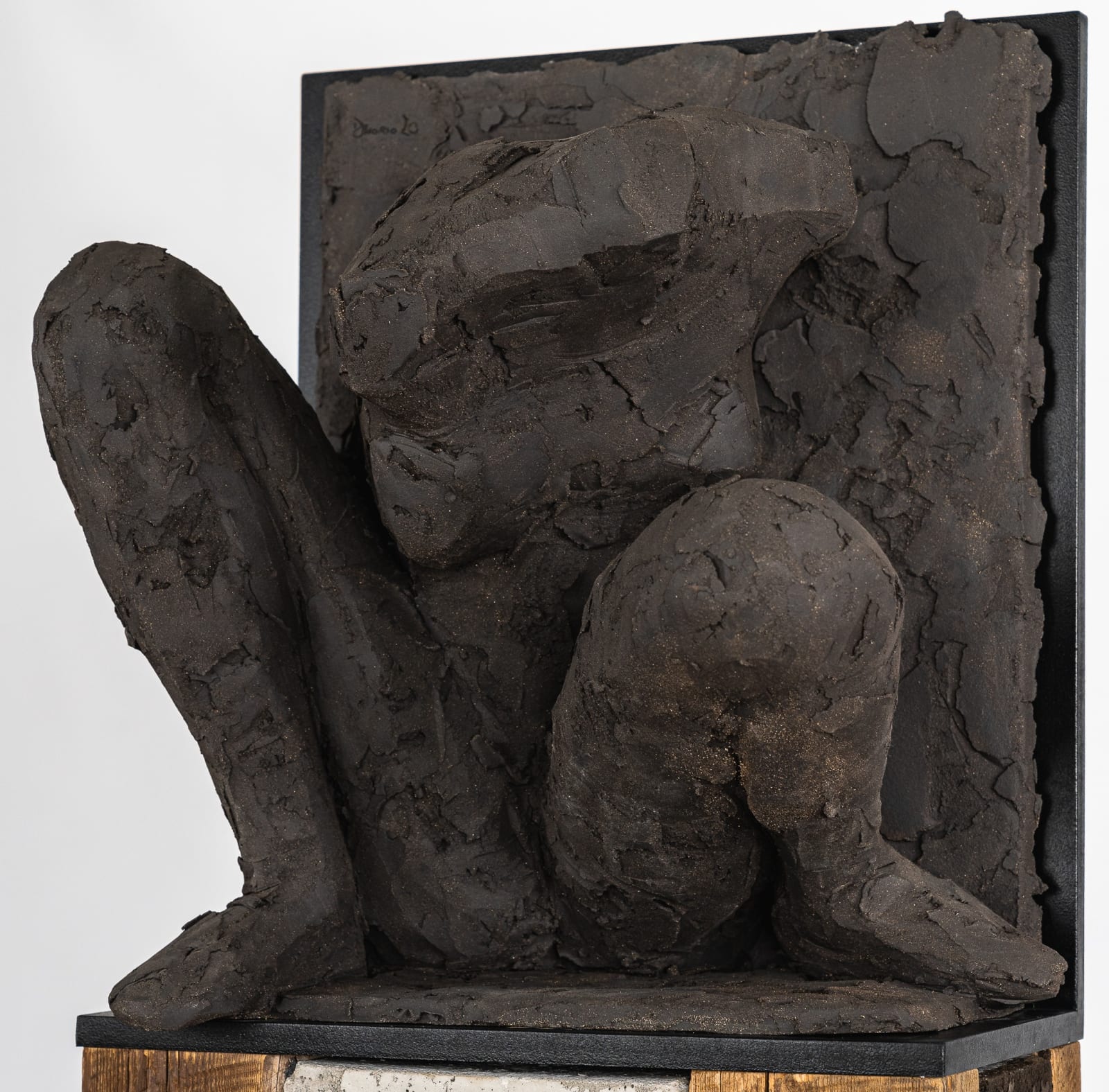 Ceramic relief in black clay in sculptor Emilio DiIorio's Women of Troy series.