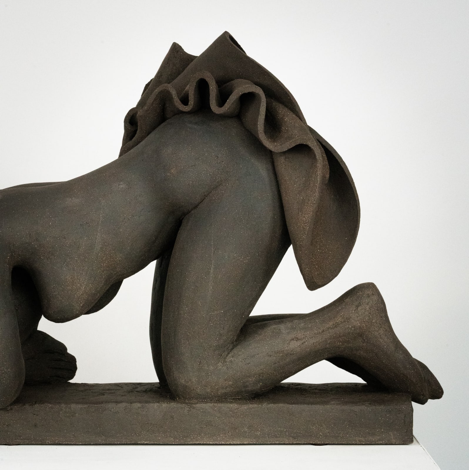 Figurative ceramics sculpture by artist Emilio DiIorio. Female figure is No. 5 in artist's Seated Bathers series in black clay.