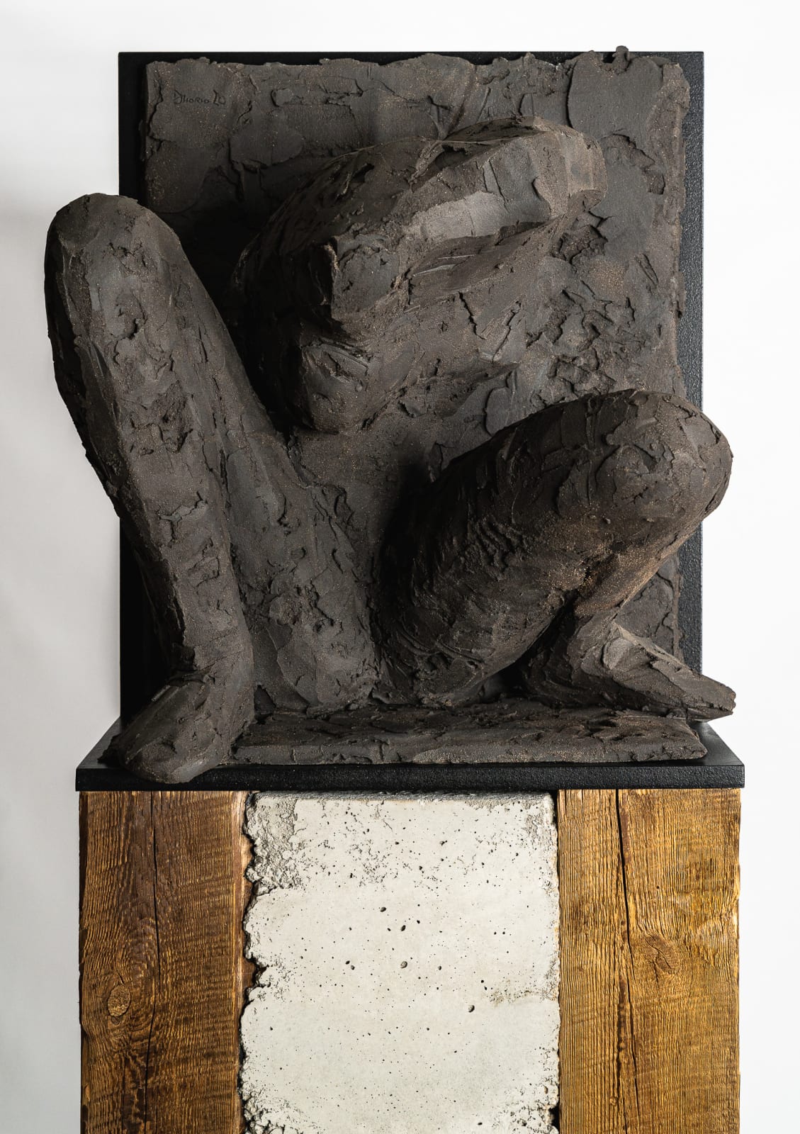 Ceramic relief in black clay in sculptor Emilio DiIorio's Women of Troy series.