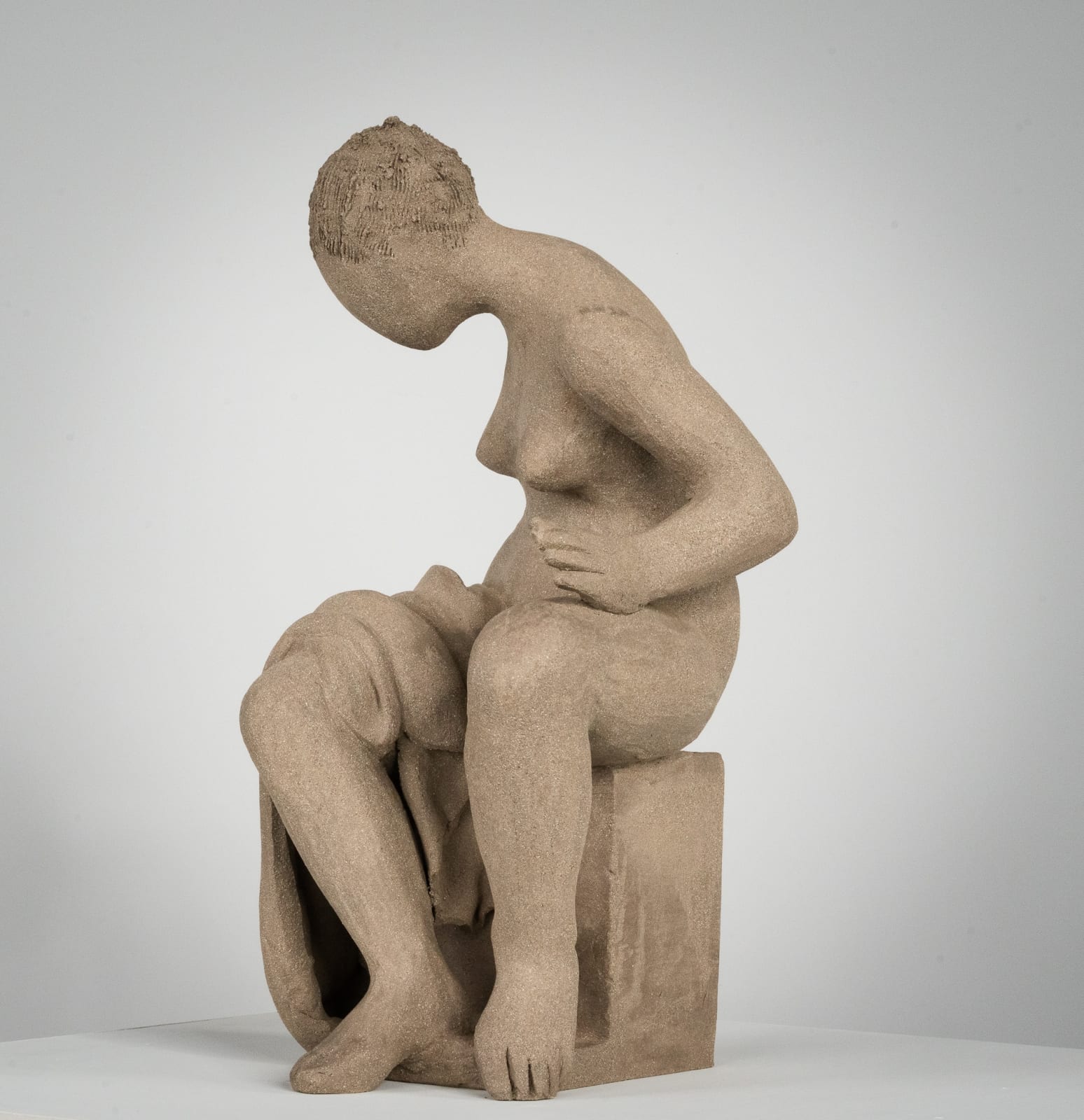 Figurative ceramics sculpture by artist Emilio DiIorio. Female figure is No. 4 in artist's Seated Bathers series in gray clay.