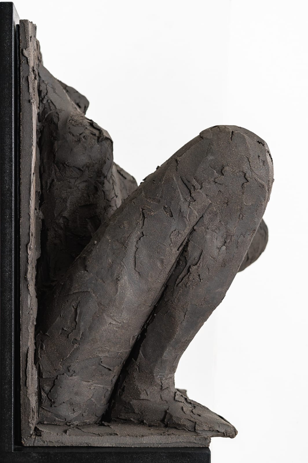 Ceramic relief in black clay in sculptor Emilio DiIorio's Women of Troy series.