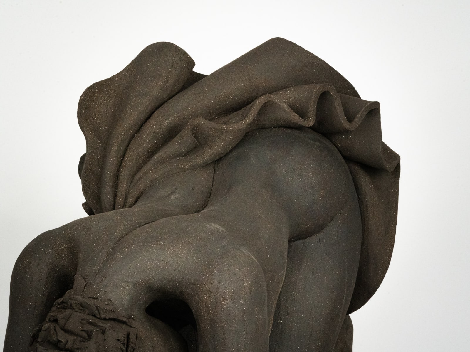 Figurative ceramics sculpture by artist Emilio DiIorio. Female figure is No. 5 in artist's Seated Bathers series in black clay.