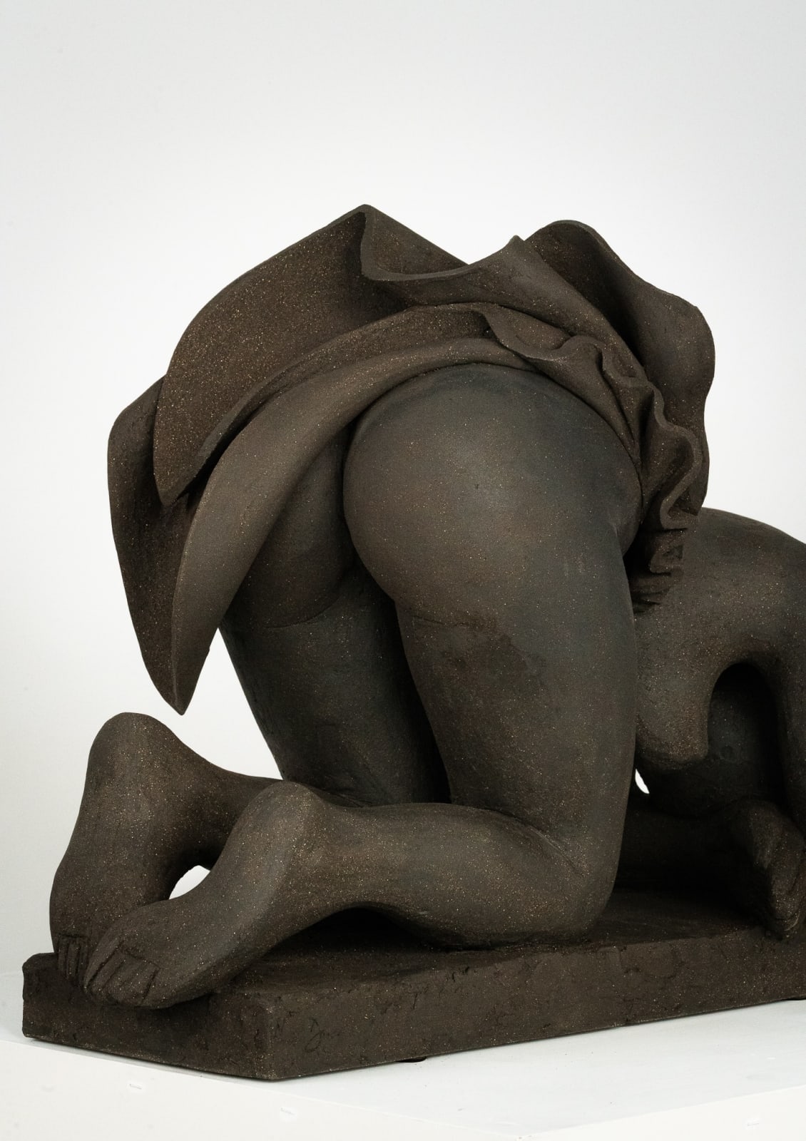 Figurative ceramics sculpture by artist Emilio DiIorio. Female figure is No. 5 in artist's Seated Bathers series in black clay.