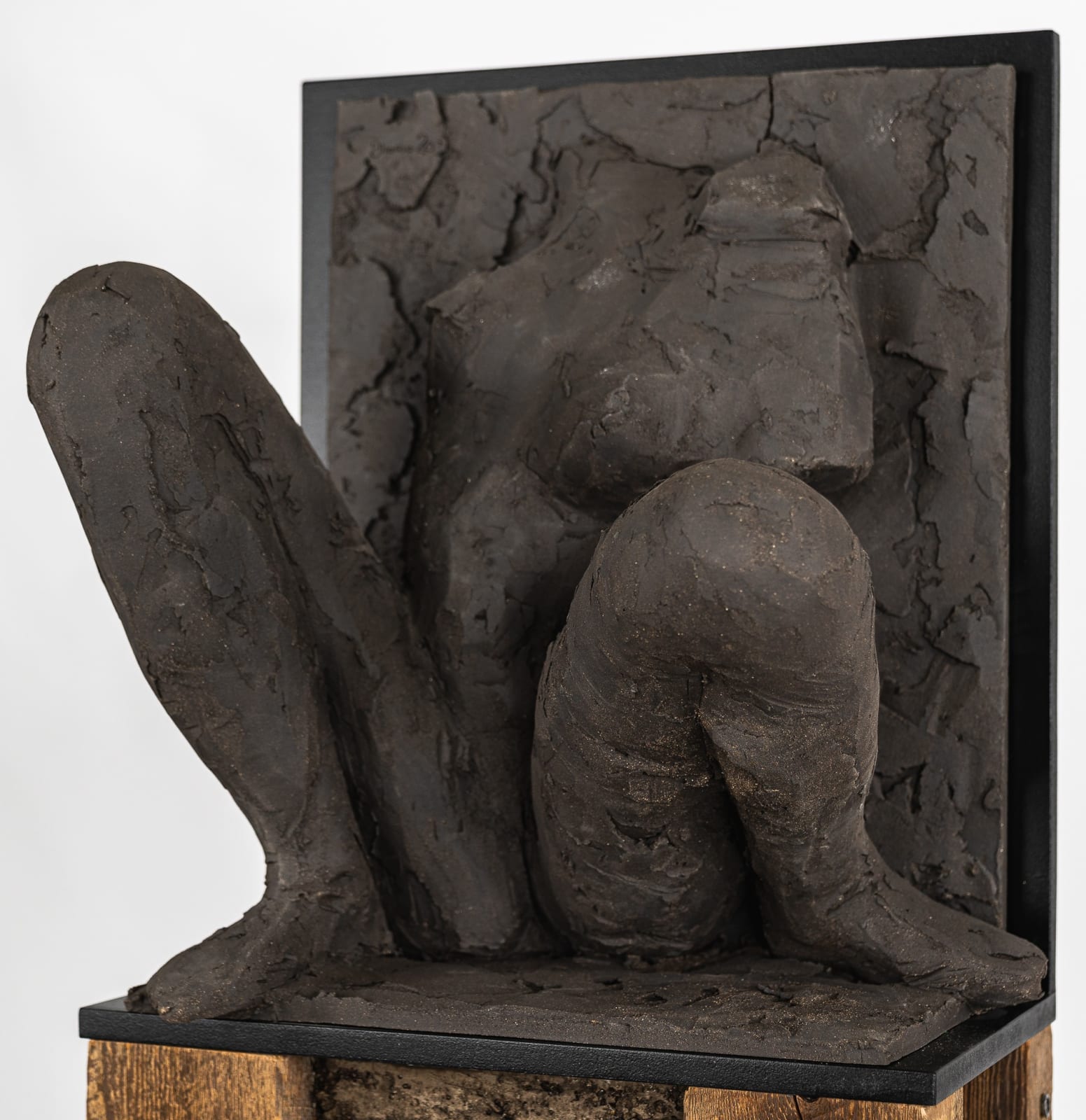 Ceramic relief in black clay in sculptor Emilio DiIorio's Women of Troy series.