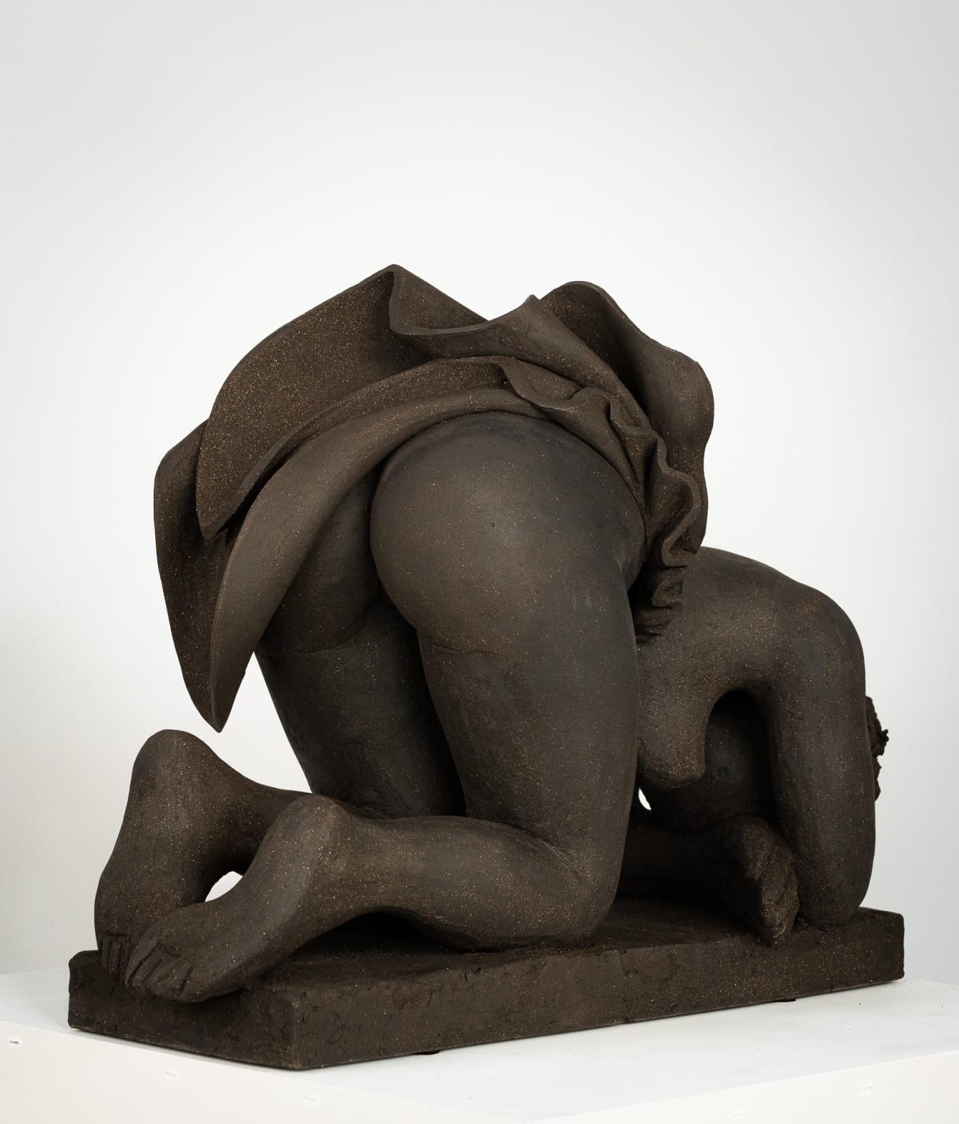 Figurative ceramics sculpture by artist Emilio DiIorio. Female figure is No. 5 in artist's Seated Bathers series in black clay.