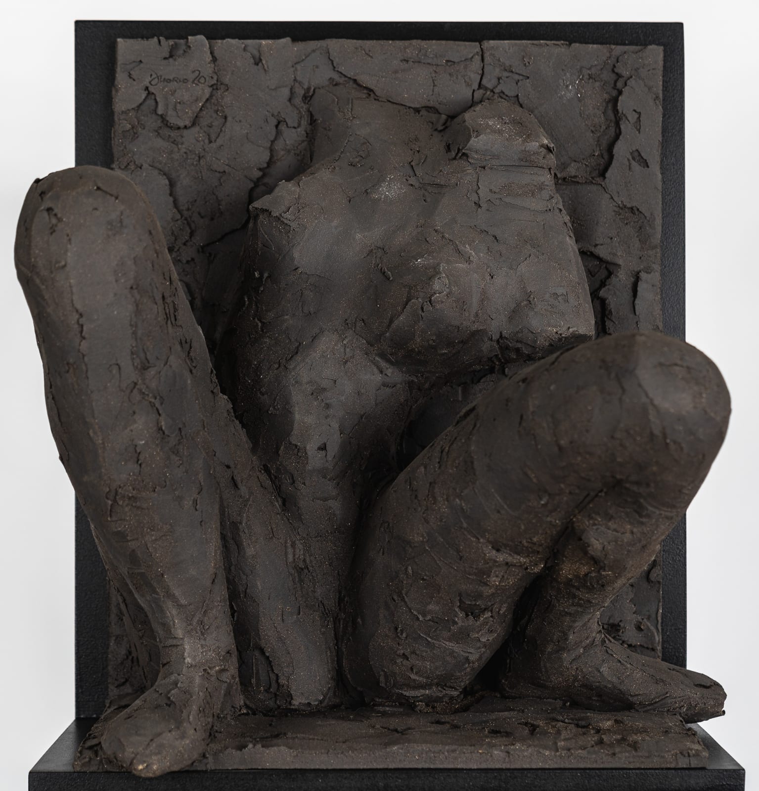 Ceramic relief in black clay in sculptor Emilio DiIorio's Women of Troy series.