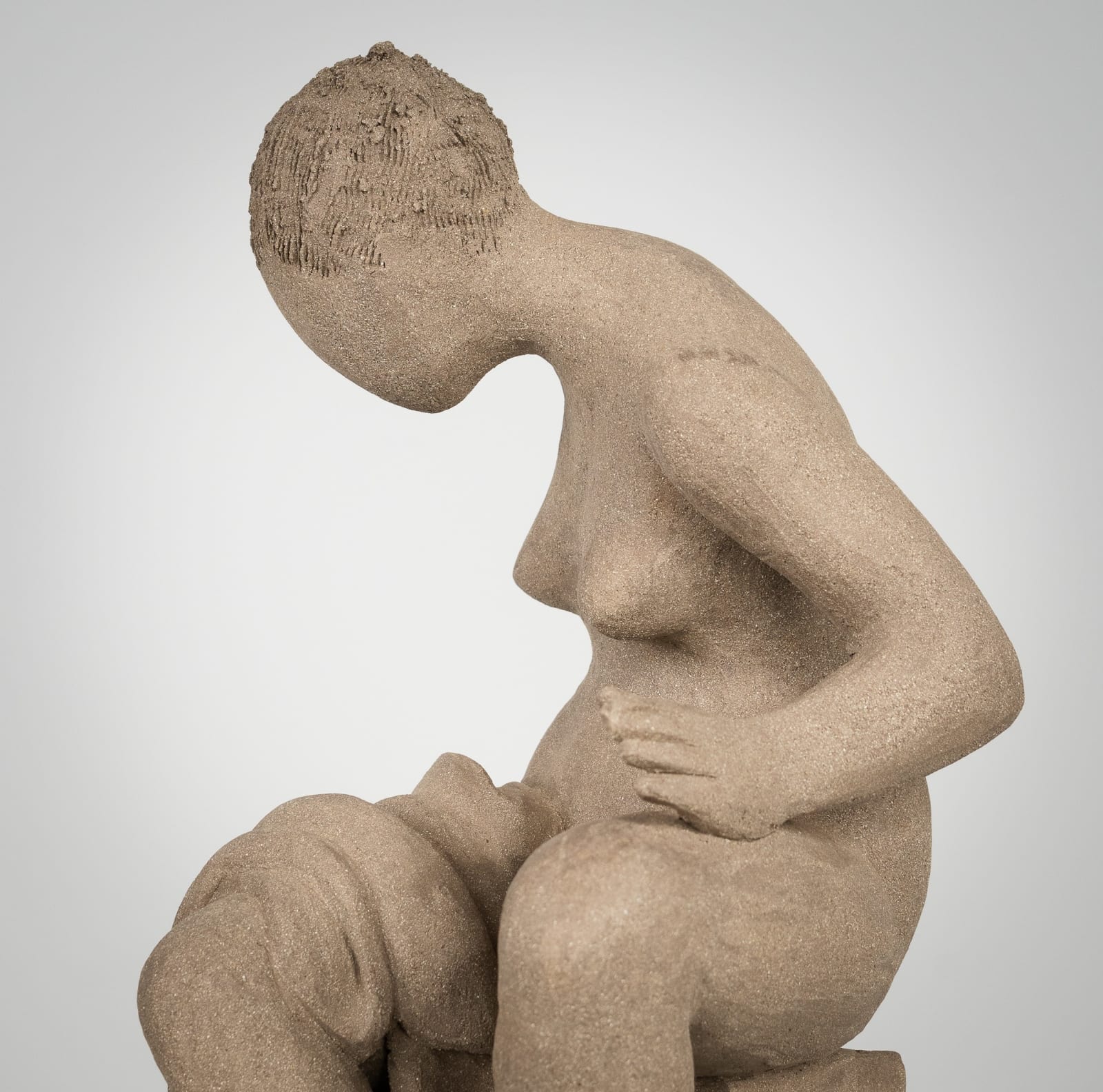 Figurative ceramics sculpture by artist Emilio DiIorio. Female figure is No. 4 in artist's Seated Bathers series in gray clay.