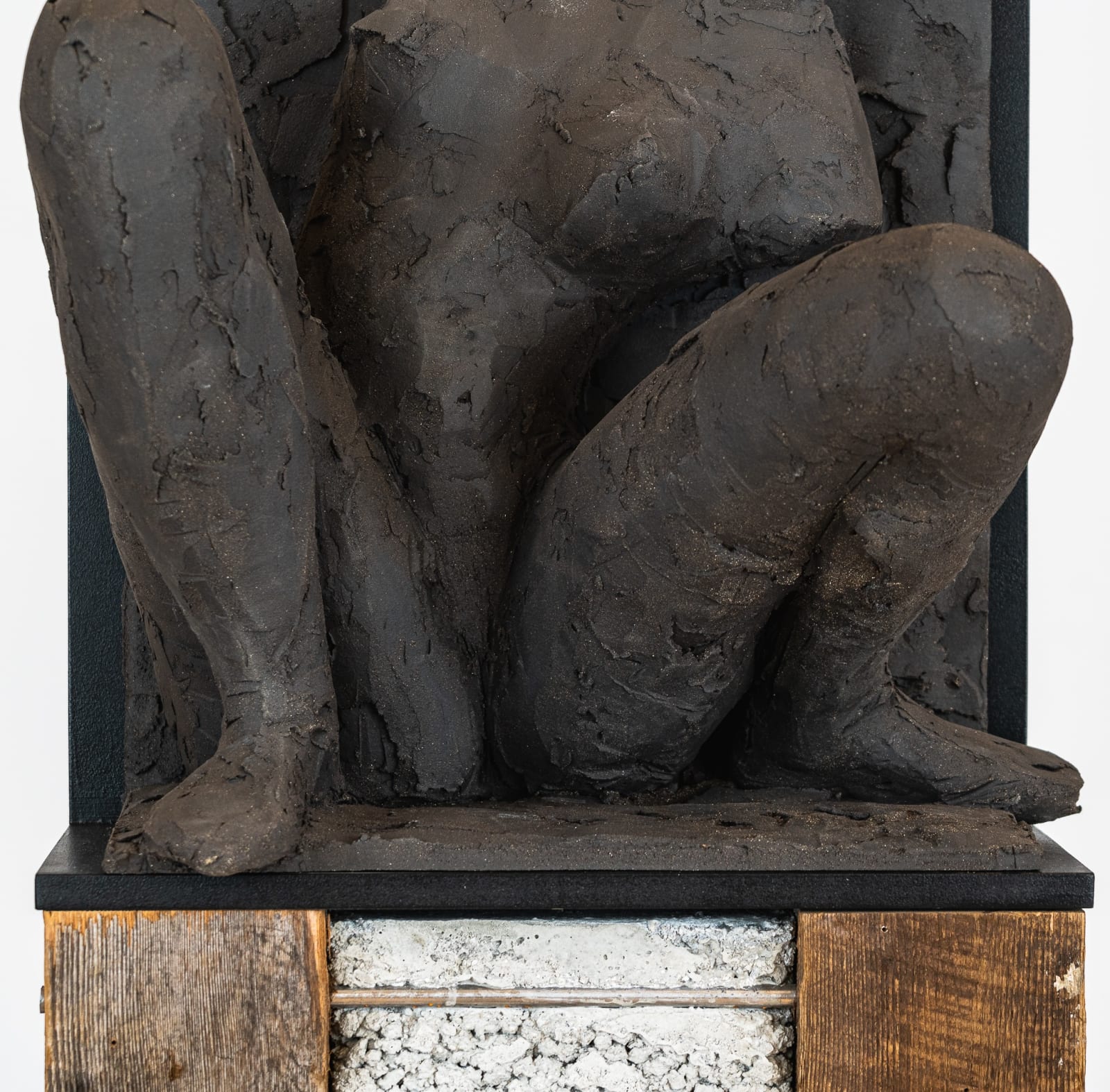 Ceramic relief in black clay in sculptor Emilio DiIorio's Women of Troy series.