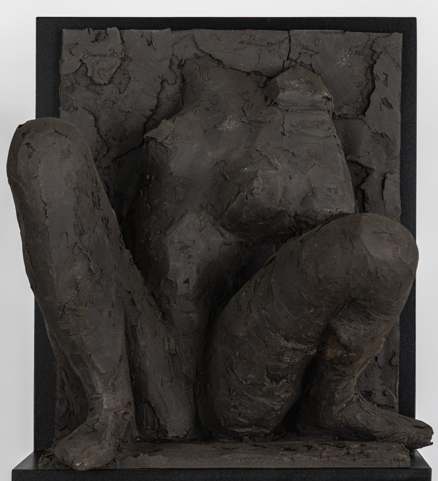 Ceramic relief in black clay in sculptor Emilio DiIorio's Women of Troy series.