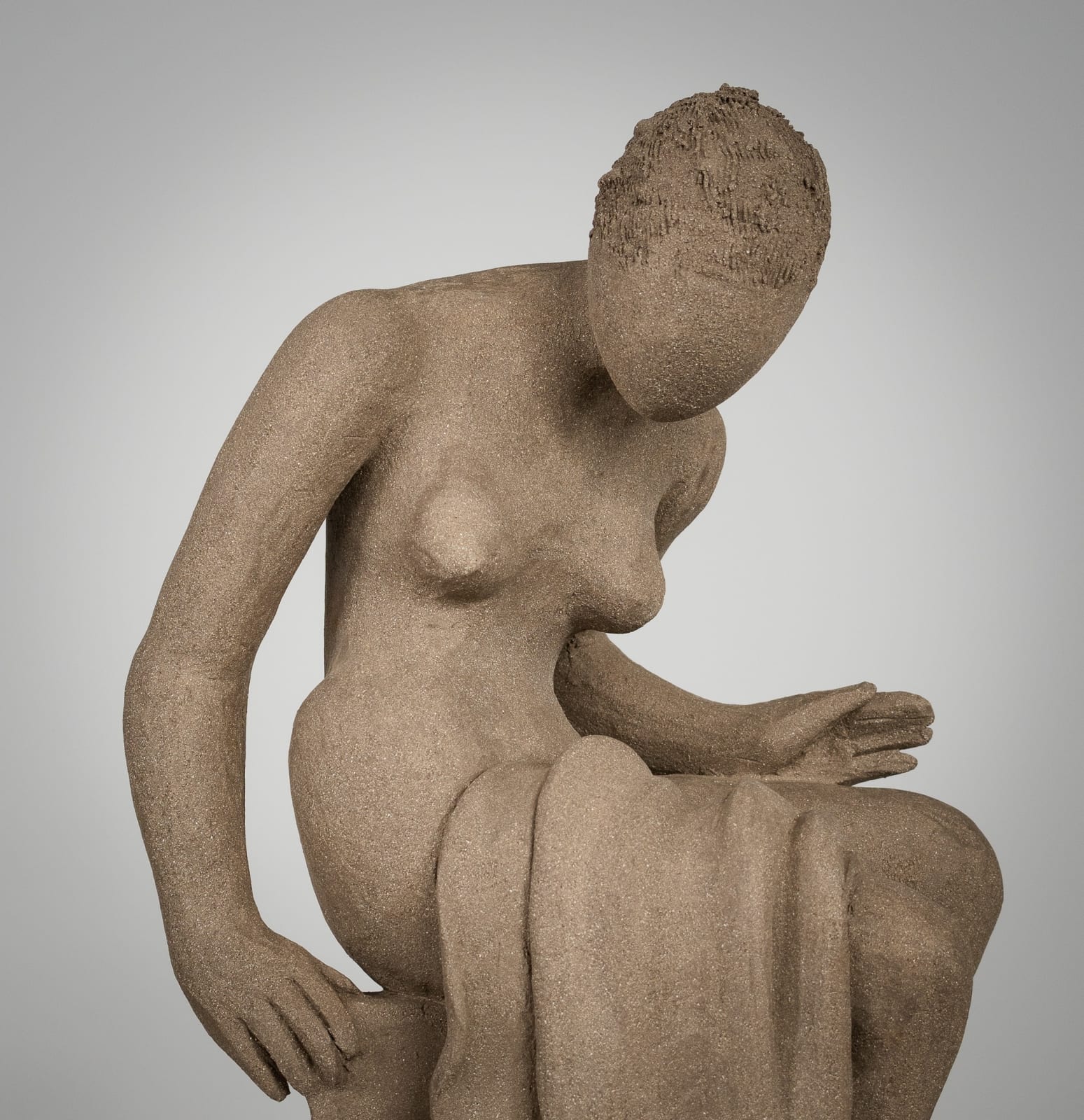 Figurative ceramics sculpture by artist Emilio DiIorio. Female figure is No. 4 in artist's Seated Bathers series in gray clay.