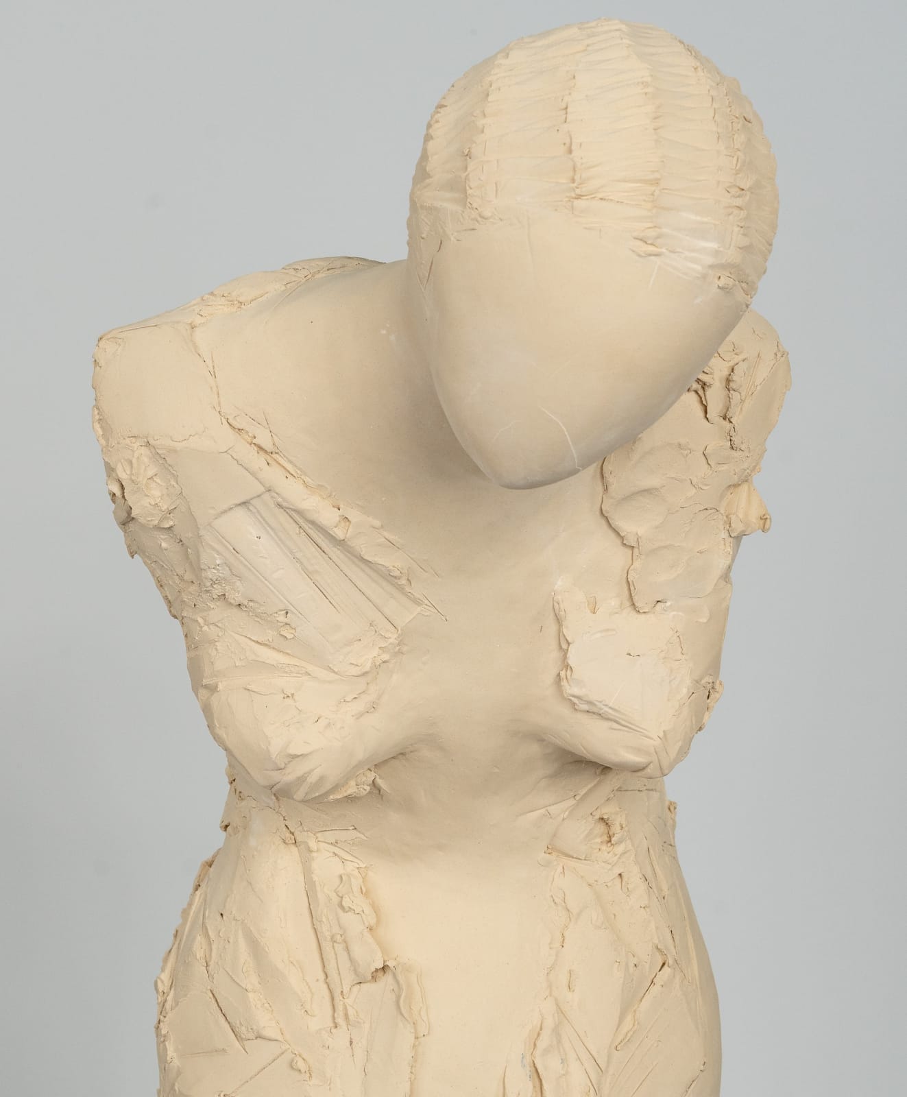 Fragmented figurative female torso in white ceramic. No. 3 in sculptor Emilio DiIorio's Sei donne series..