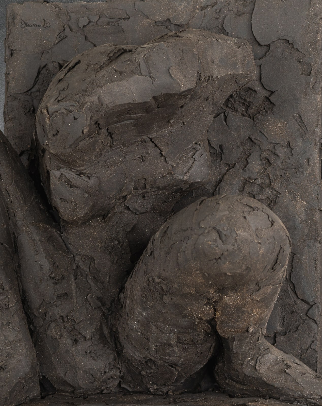 Ceramic relief in black clay in sculptor Emilio DiIorio's Women of Troy series.