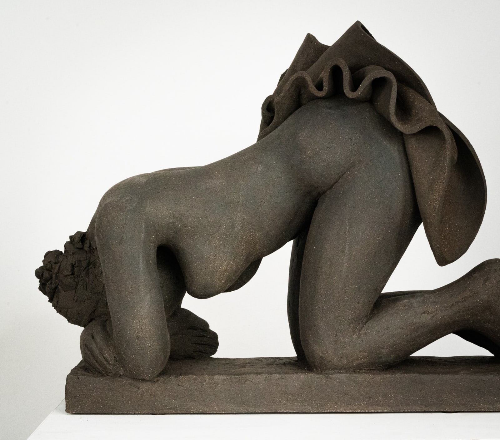 Figurative ceramics sculpture by artist Emilio DiIorio. Female figure is No. 5 in artist's Seated Bathers series in black clay.