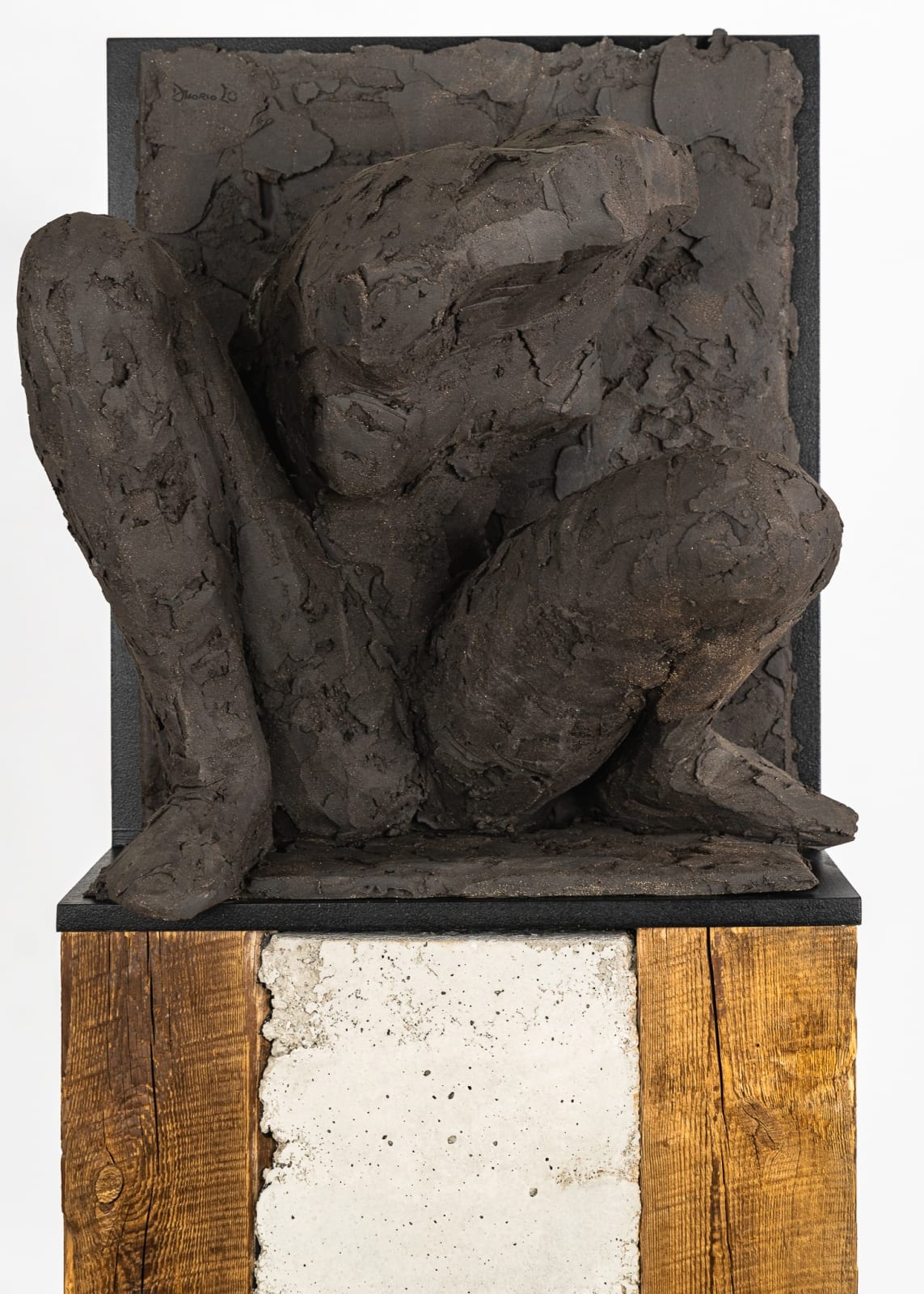 Ceramic relief in black clay in sculptor Emilio DiIorio's Women of Troy series.