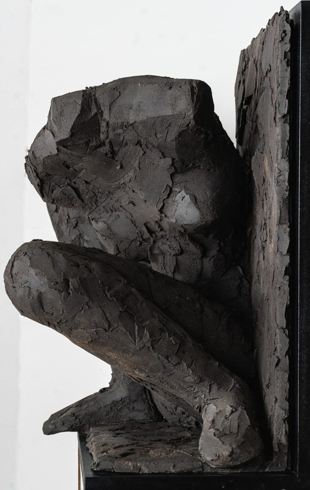 Ceramic relief in black clay in sculptor Emilio DiIorio's Women of Troy series.
