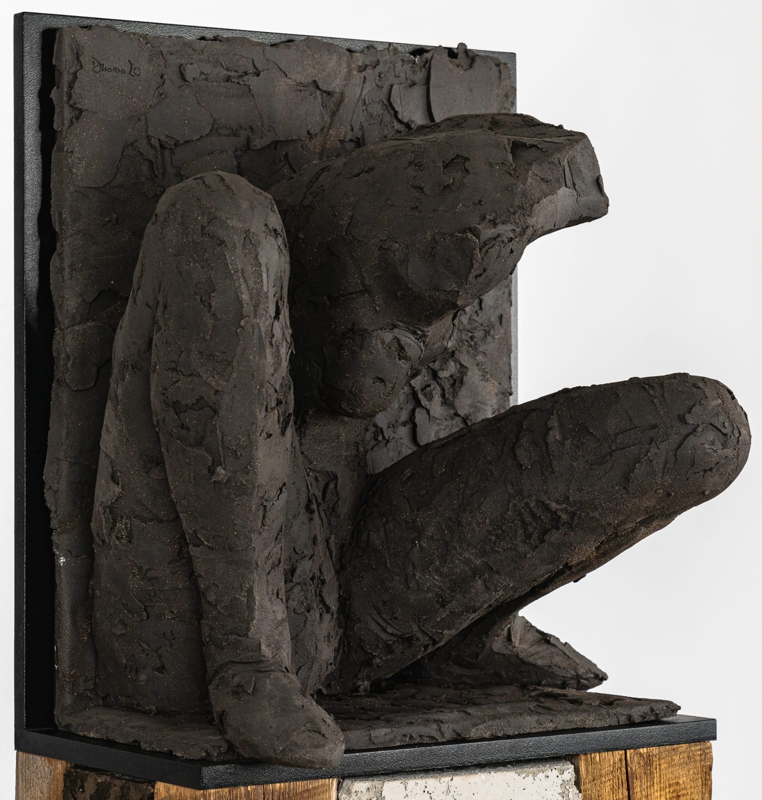 Ceramic relief in black clay in sculptor Emilio DiIorio's Women of Troy series.