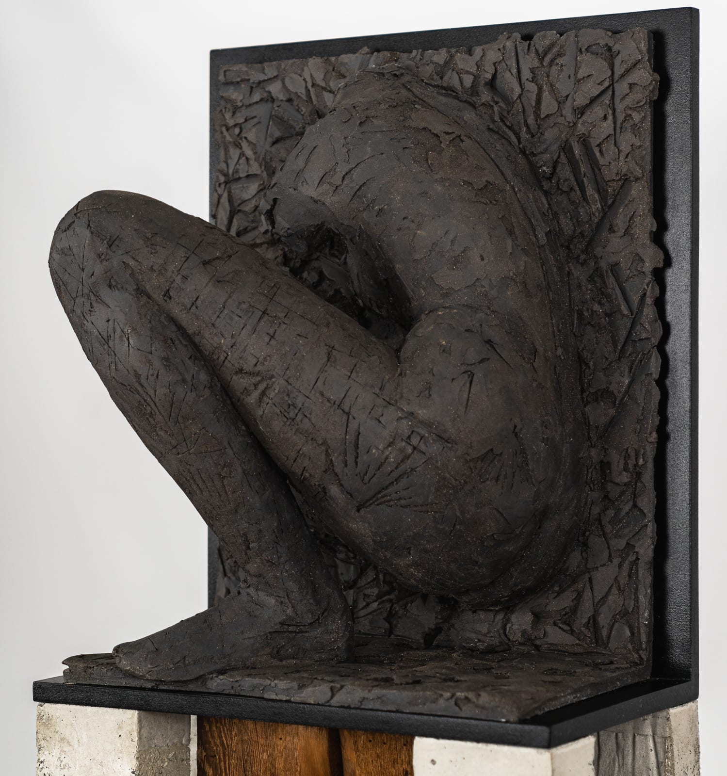 Ceramic relief in black clay in sculptor Emilio DiIorio's Women of Troy series.