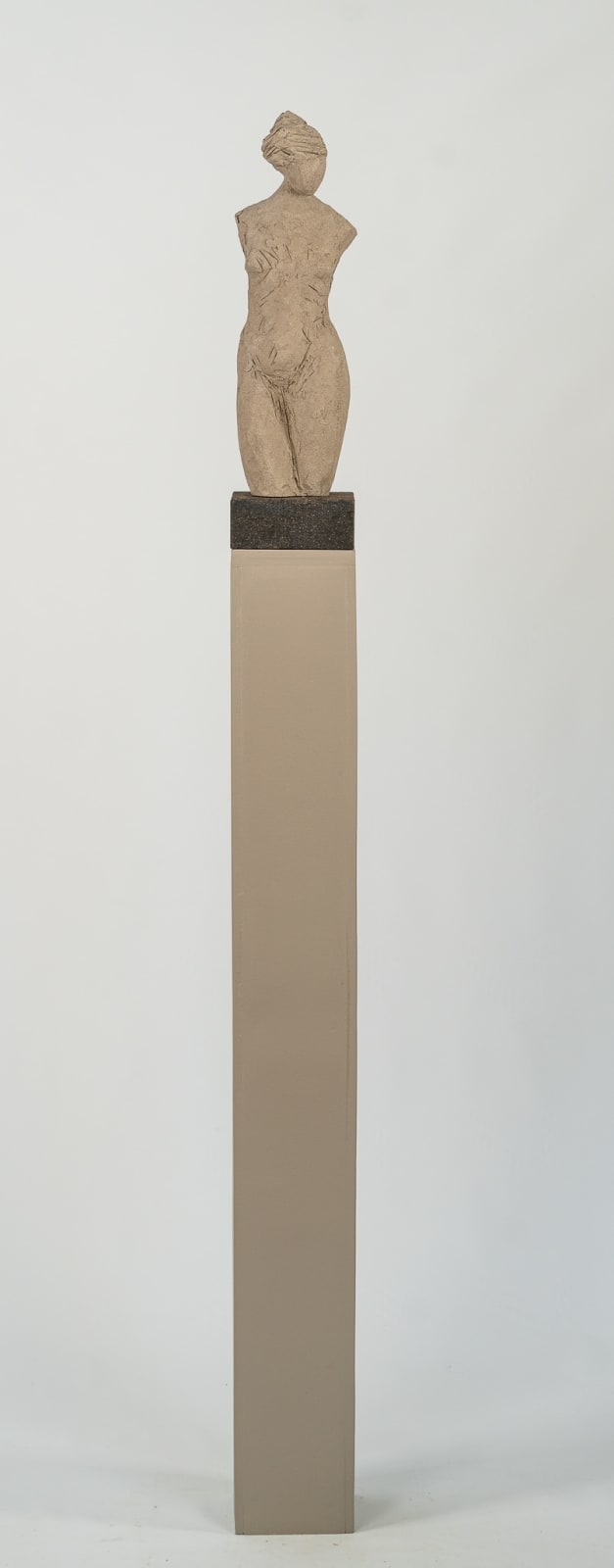 Fragmented figurative female torso in gray clay by sculptor Emilio DiIorio.