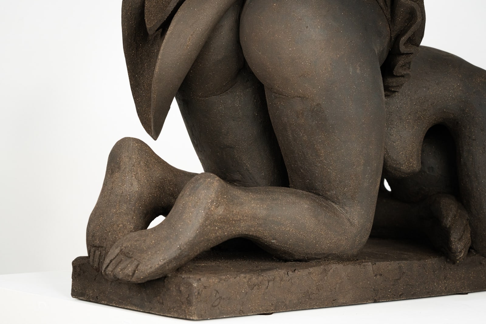 Figurative ceramics sculpture by artist Emilio DiIorio. Female figure is No. 5 in artist's Seated Bathers series in black clay.