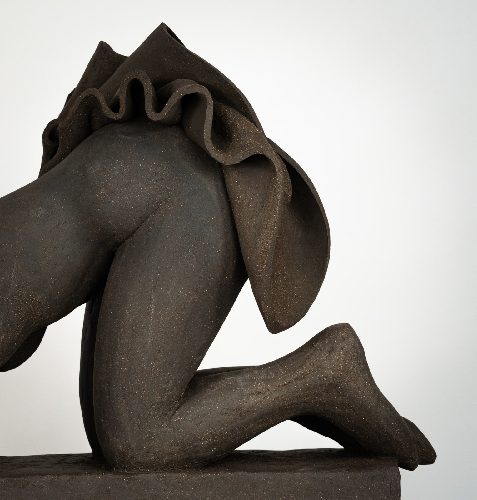 Figurative ceramics sculpture by artist Emilio DiIorio. Female figure is No. 5 in artist's Seated Bathers series in black clay.