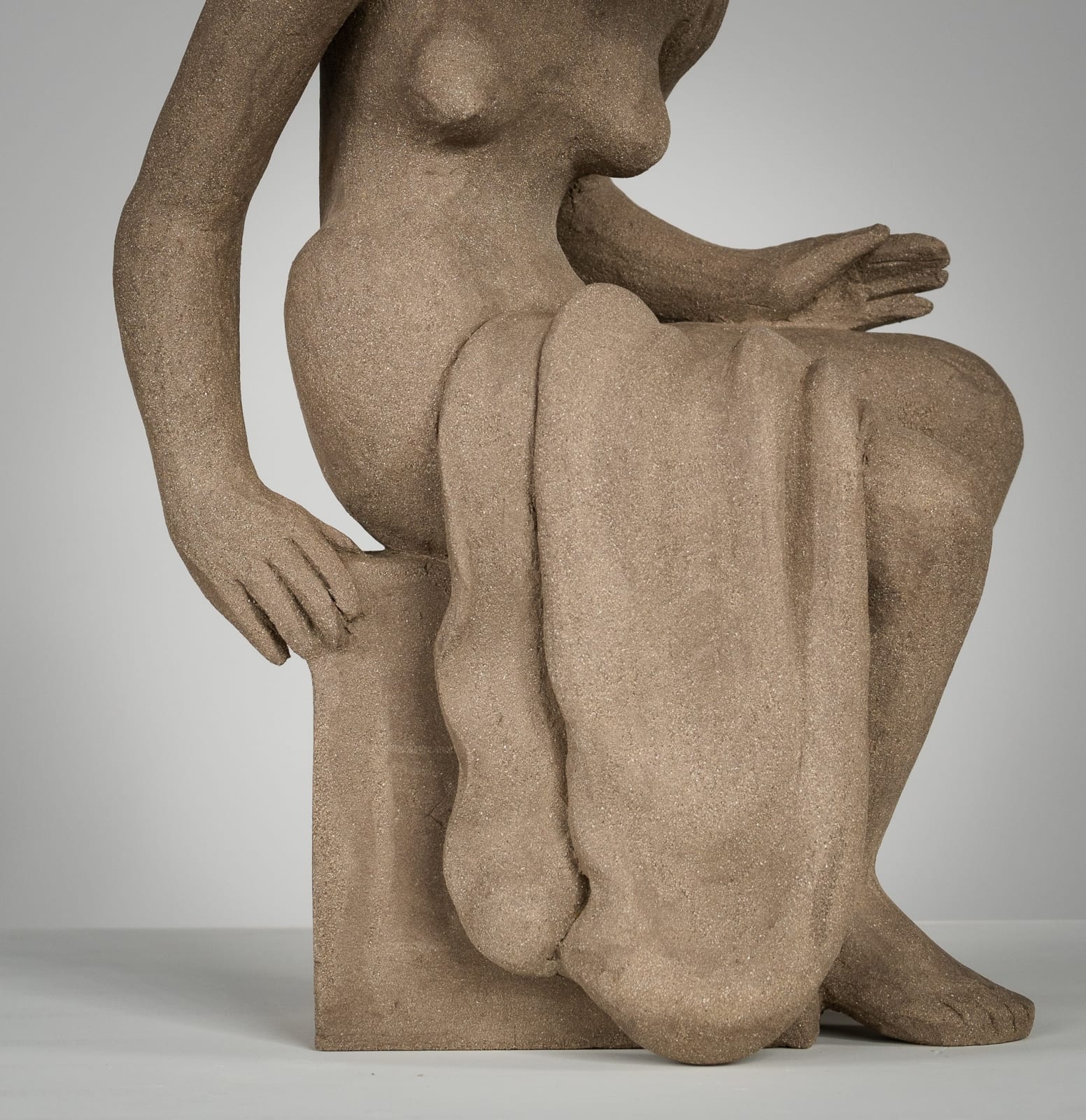 Figurative ceramics sculpture by artist Emilio DiIorio. Female figure is No. 4 in artist's Seated Bathers series in gray clay.