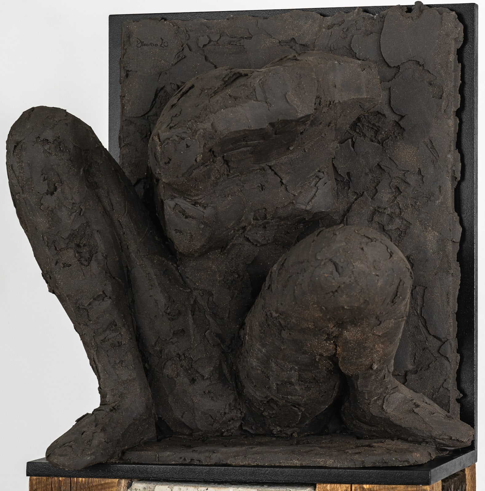 Ceramic relief in black clay in sculptor Emilio DiIorio's Women of Troy series.