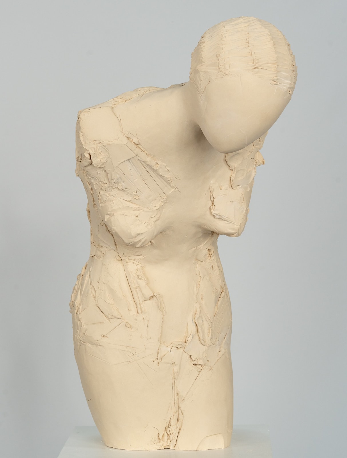 Fragmented figurative female torso in white ceramic. No. 3 in sculptor Emilio DiIorio's Sei donne series..