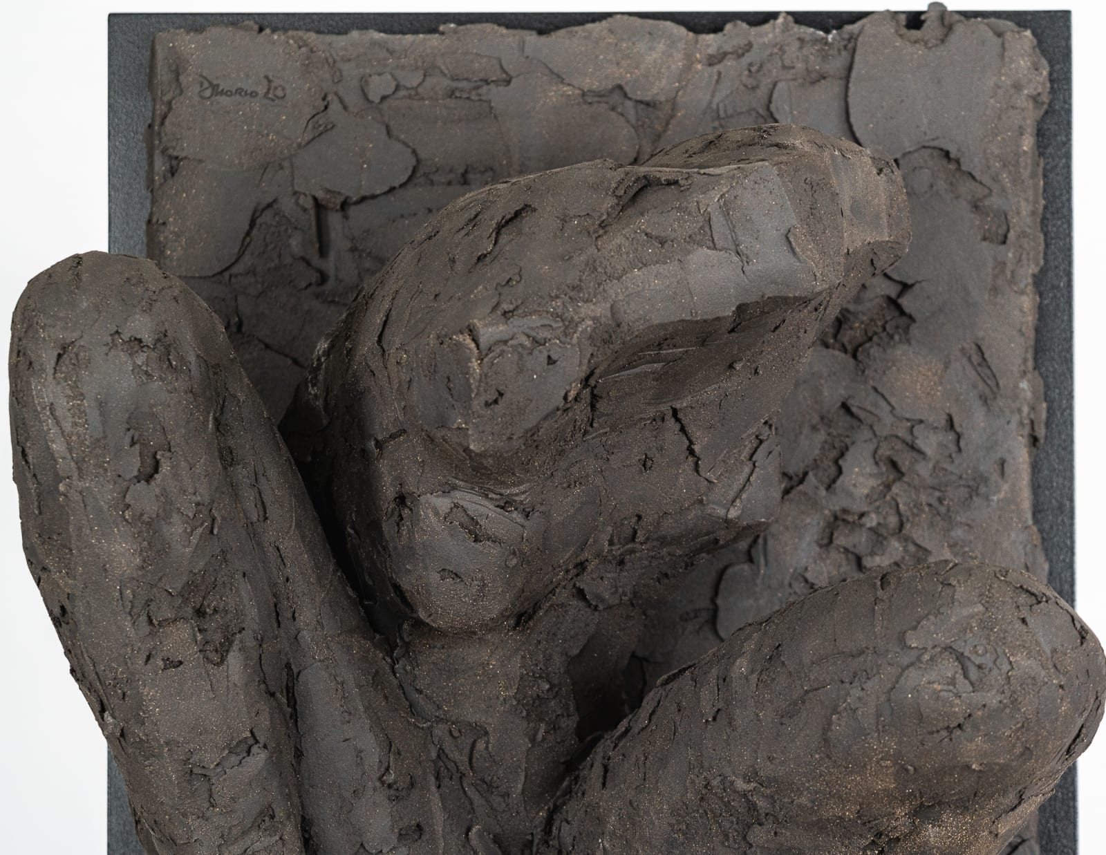 Ceramic relief in black clay in sculptor Emilio DiIorio's Women of Troy series.