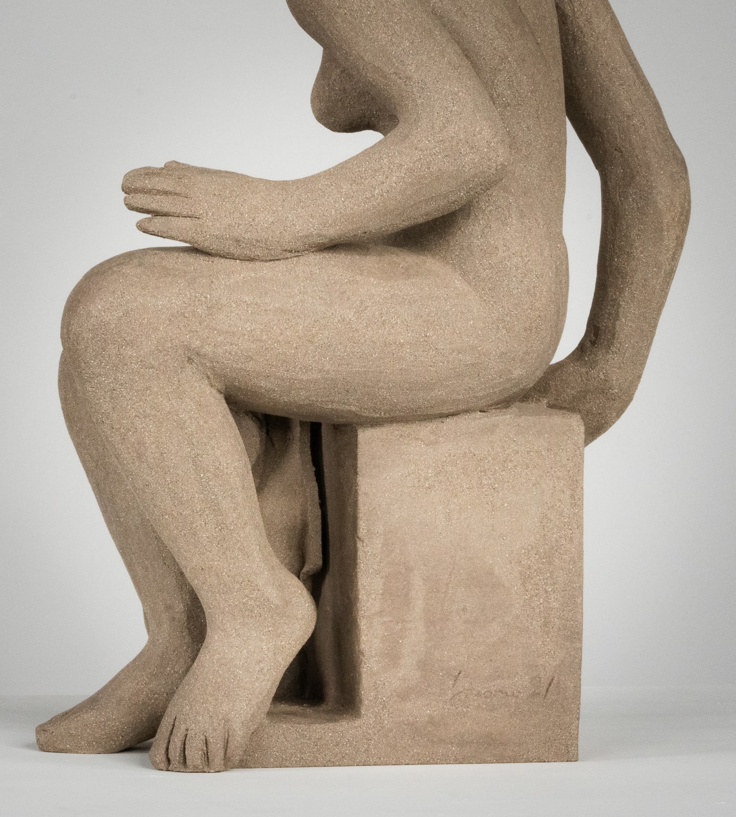 Figurative ceramics sculpture by artist Emilio DiIorio. Female figure is No. 4 in artist's Seated Bathers series in gray clay.