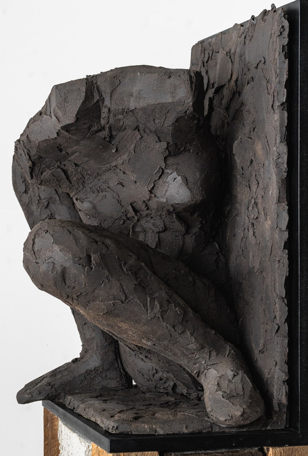 Ceramic relief in black clay in sculptor Emilio DiIorio's Women of Troy series.
