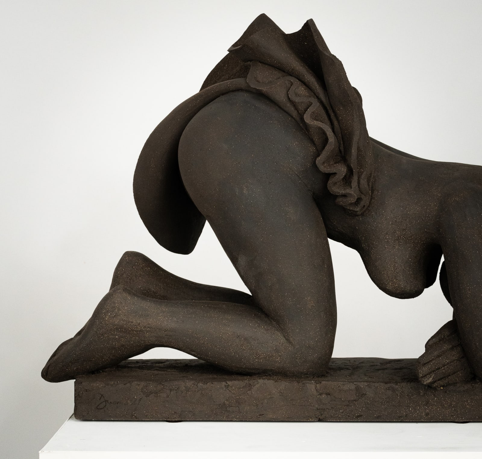 Figurative ceramics sculpture by artist Emilio DiIorio. Female figure is No. 5 in artist's Seated Bathers series in black clay.
