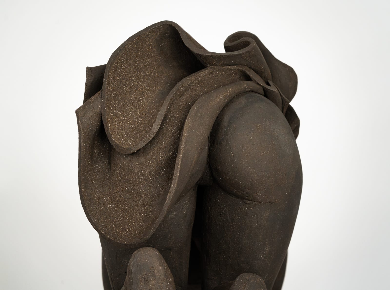Figurative ceramics sculpture by artist Emilio DiIorio. Female figure is No. 5 in artist's Seated Bathers series in black clay.
