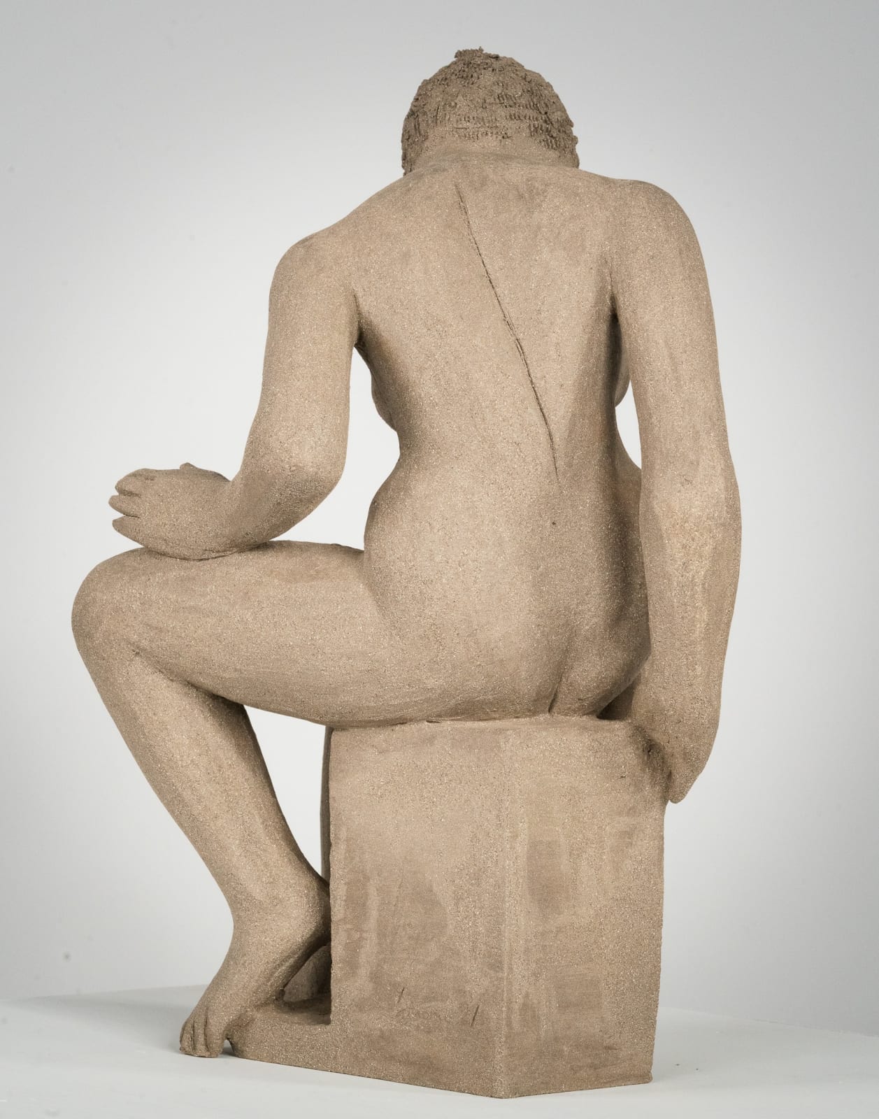 Figurative ceramics sculpture by artist Emilio DiIorio. Female figure is No. 4 in artist's Seated Bathers series in gray clay.
