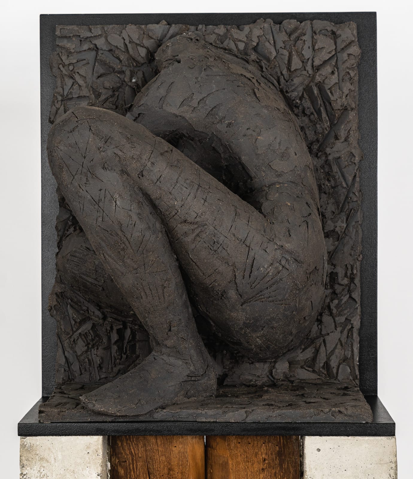 Ceramic relief in black clay in sculptor Emilio DiIorio's Women of Troy series.