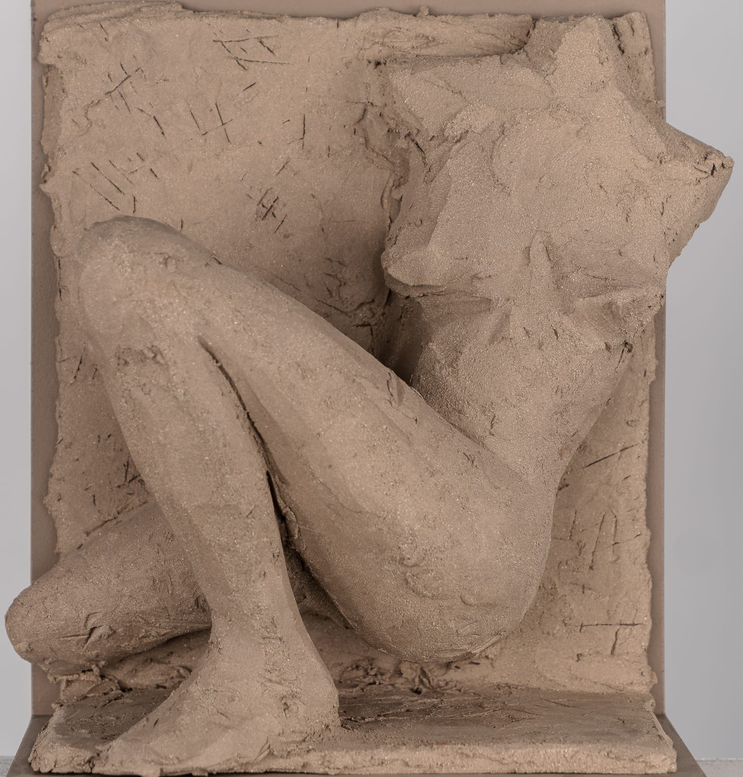 Figurative ceramic relief by artist Emilio DiIorio in Women of Troy series in gray clay.