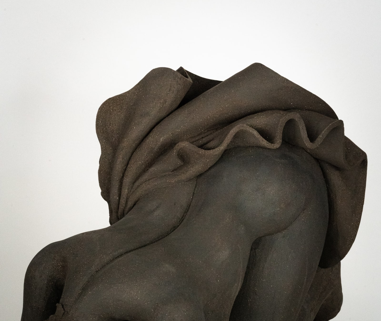 Figurative ceramics sculpture by artist Emilio DiIorio. Female figure is No. 5 in artist's Seated Bathers series in black clay.
