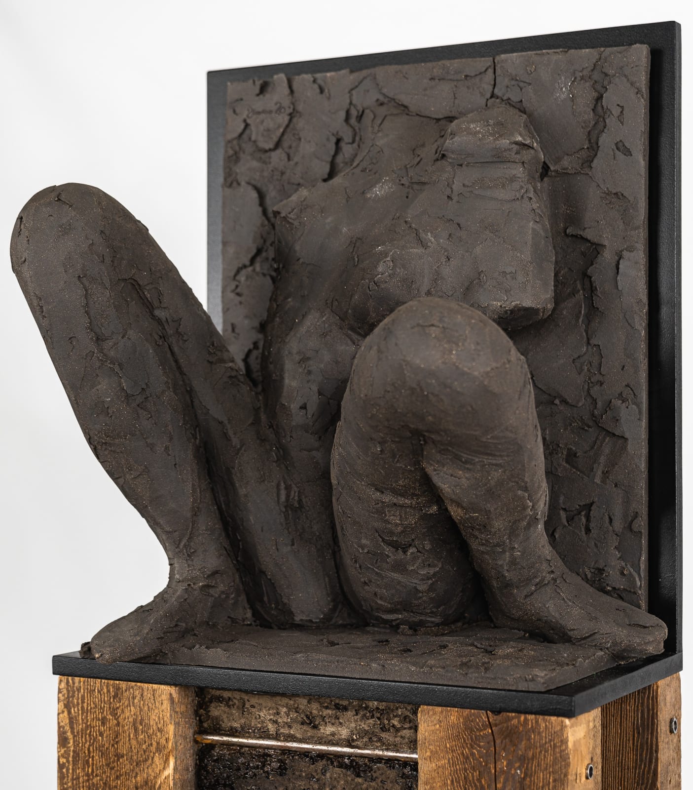 Ceramic relief in black clay in sculptor Emilio DiIorio's Women of Troy series.