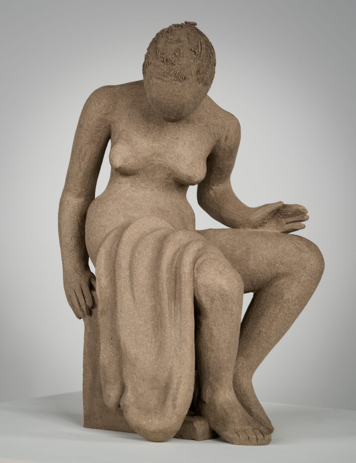 Figurative ceramics sculpture by artist Emilio DiIorio. Female figure is No. 4 in artist's Seated Bathers series in gray clay.