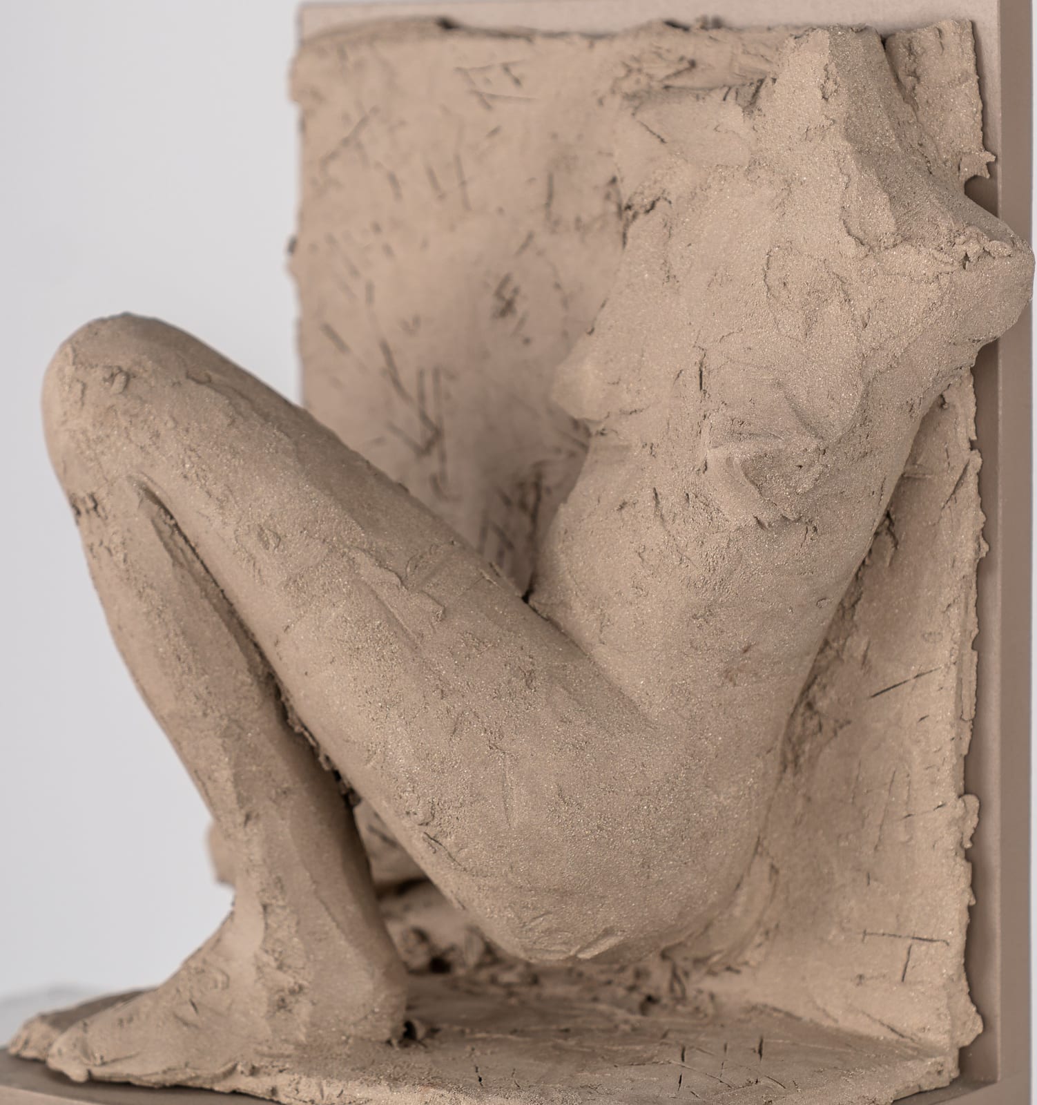 Figurative ceramic relief by artist Emilio DiIorio in Women of Troy series in gray clay.