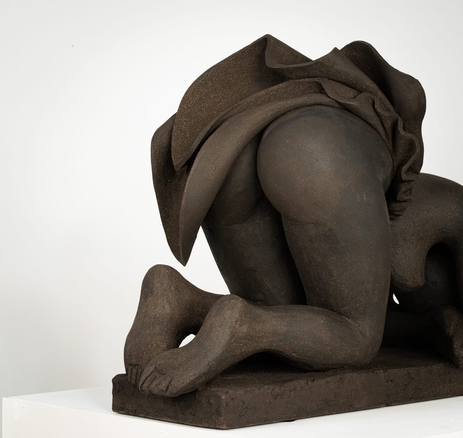 Figurative ceramics sculpture by artist Emilio DiIorio. Female figure is No. 5 in artist's Seated Bathers series in black clay.