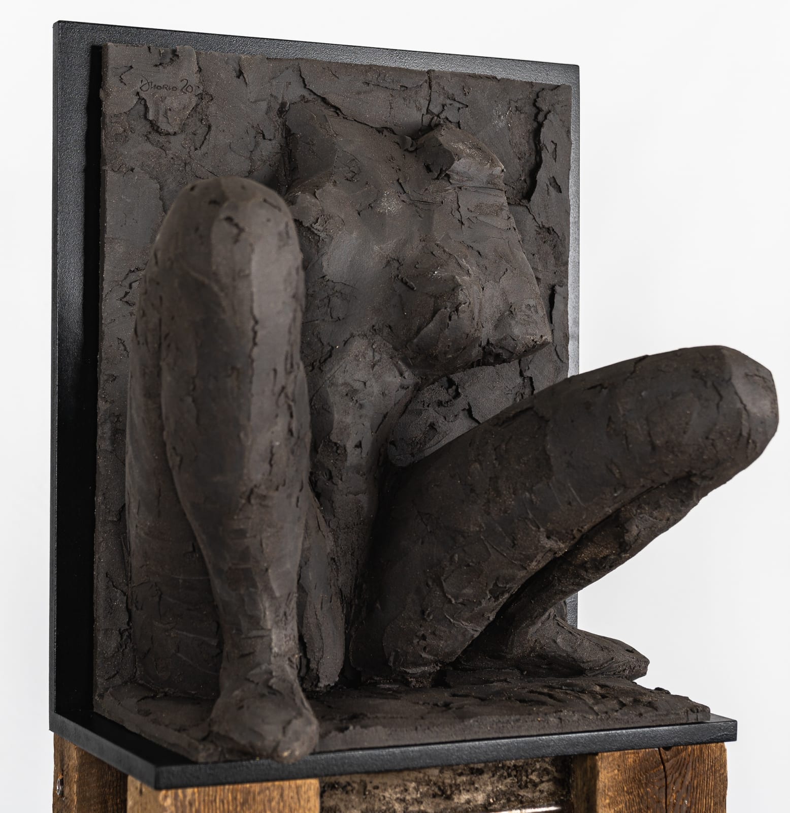 Ceramic relief in black clay in sculptor Emilio DiIorio's Women of Troy series.