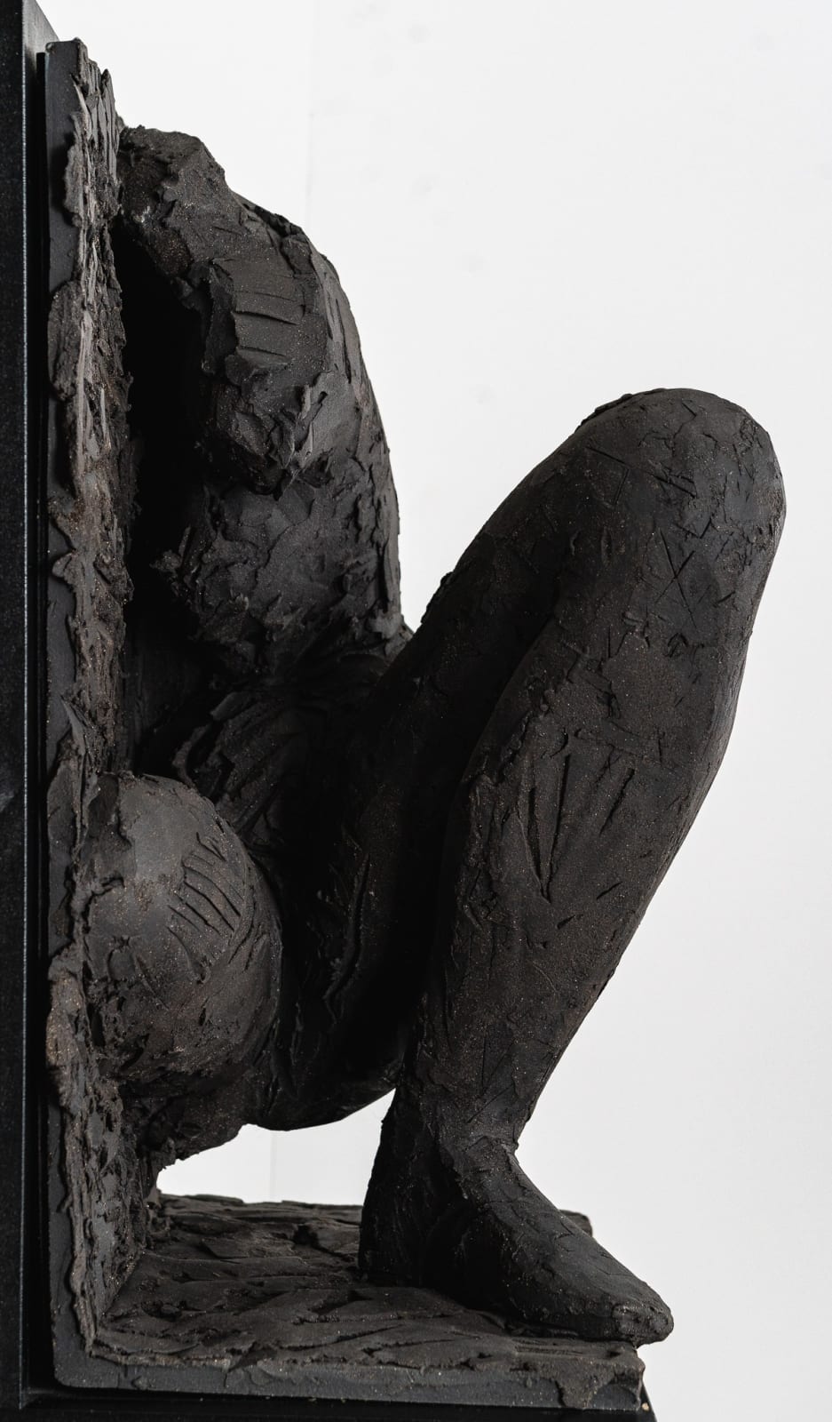 Ceramic relief in black clay in sculptor Emilio DiIorio's Women of Troy series.