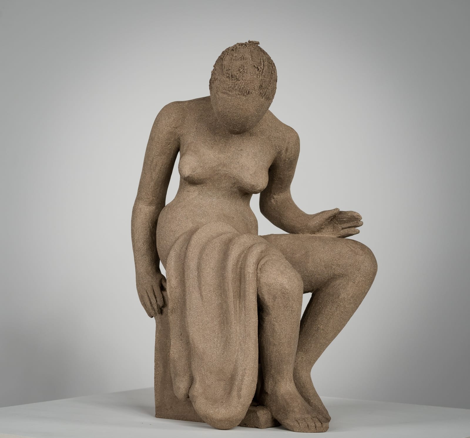 Figurative ceramics sculpture by artist Emilio DiIorio. Female figure is No. 4 in artist's Seated Bathers series in gray clay.